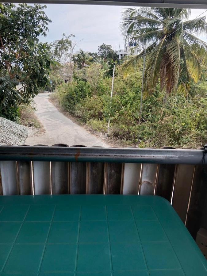 Titanic'S Nipa Hut Hostel Moalboal Buitenkant foto